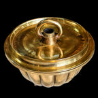 BRONZE CAKE VESSEL